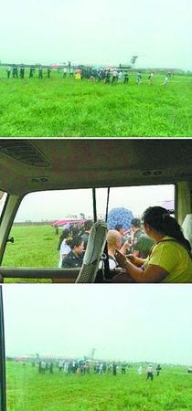 冲出跑道的飞机停在草坪上。据“央视新闻”微博图片