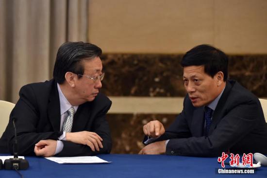 谢伏瞻（右）。 <a target='_blank' href='http://www.chinanews.com/'>中新社</a>记者 金硕 摄