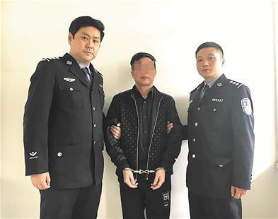 梅光明（中）落网。 楚天都市报 图