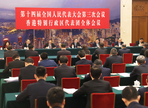 3月7日上午，中共中央政治局常委、国务院副总理丁薛祥参加十四届全国人大三次会议香港代表团审议。新华社记者 刘卫兵 摄