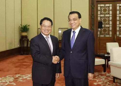 国务院总理李克强在人民大会堂会见联合国工业发展组织总干事李勇